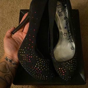 Black stiletto pumps sparkly enough to pick up most colors on a black faux suede